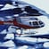 A helicopter flying over a series of snow floes